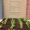 a garden with a sign