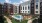 a pool in a courtyard between buildings