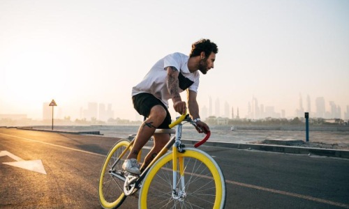 Find your perfect fit at Versa a man riding a bicycle on a road