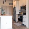 kitchen with an island bar stools