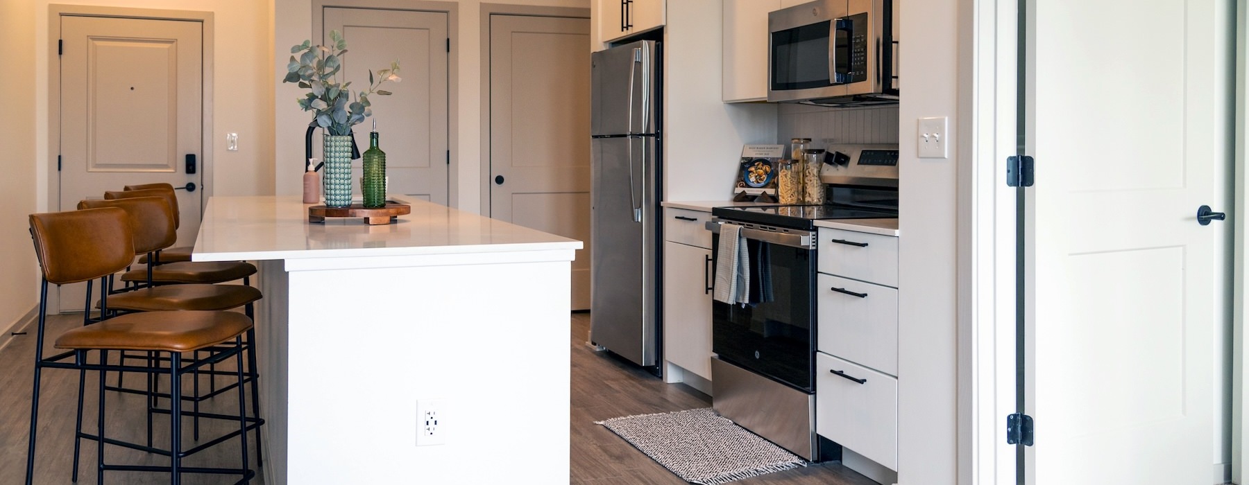 kitchen with an island bar stools