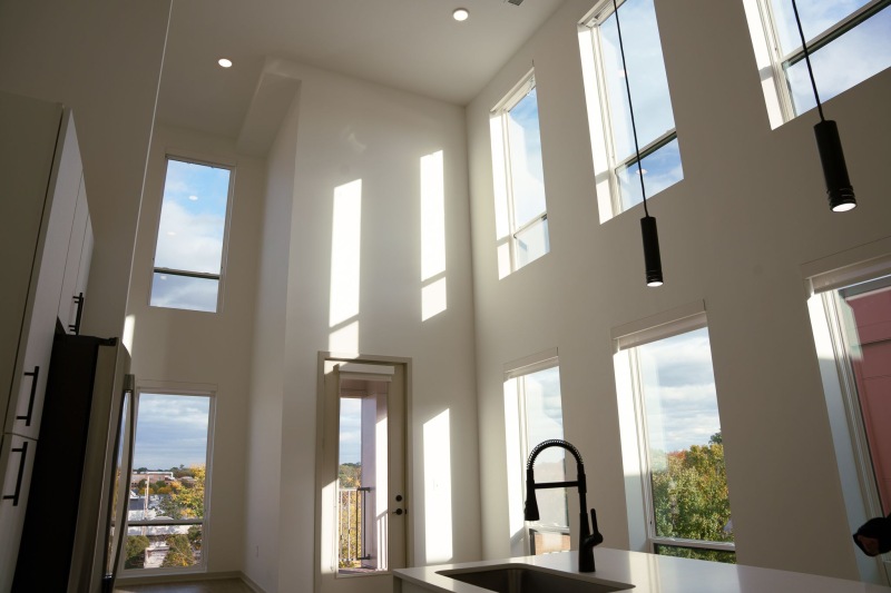 a kitchen with large windows