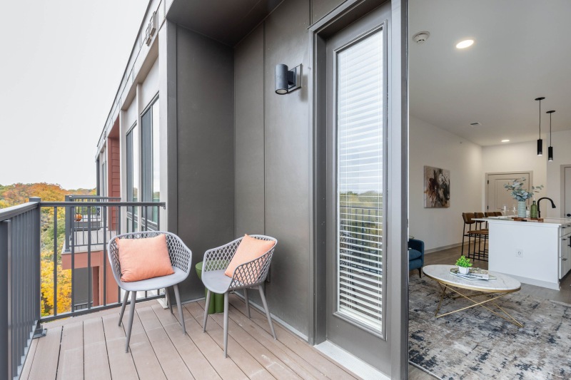 a patio with chairs and a table
