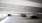 cars parked under a bridge